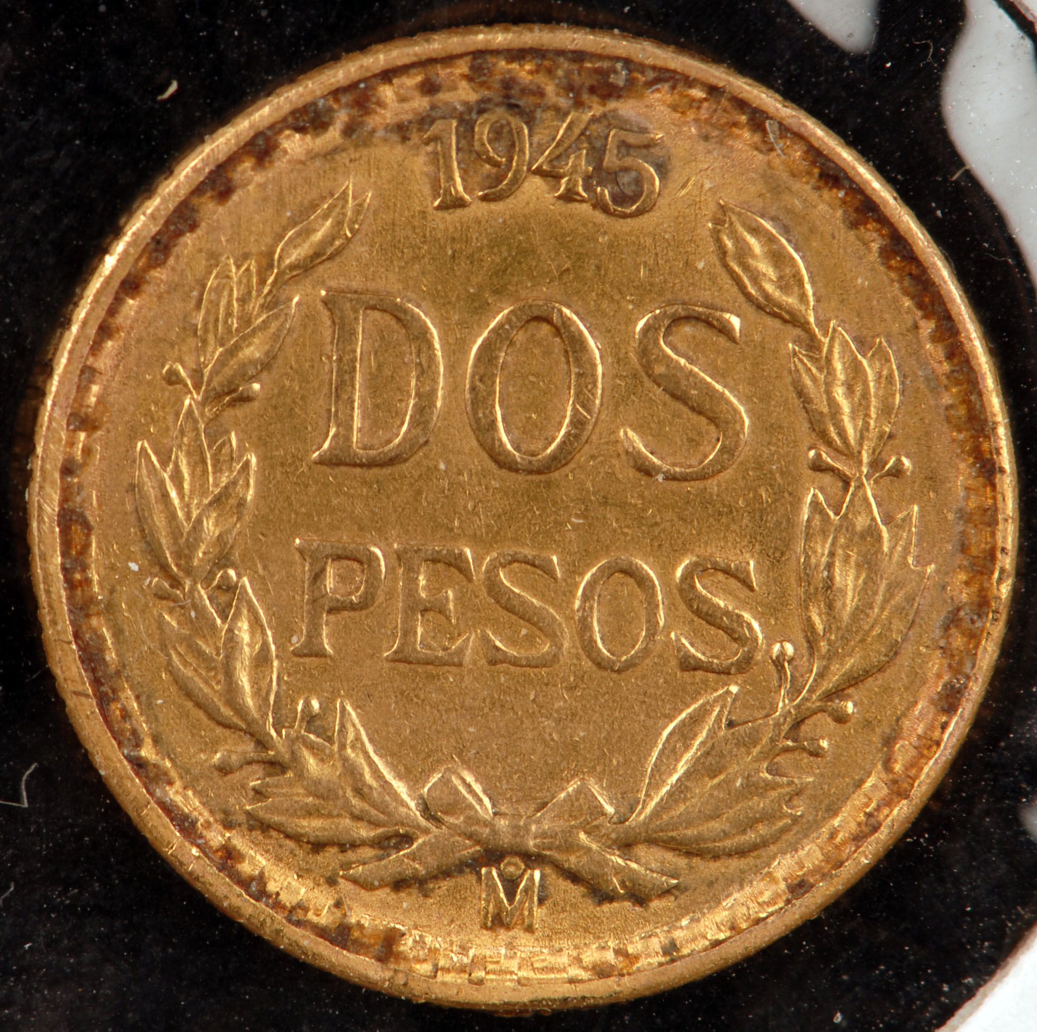 Peso Coin (restrike) pulled from a jewelry bezel. Coin shows rim